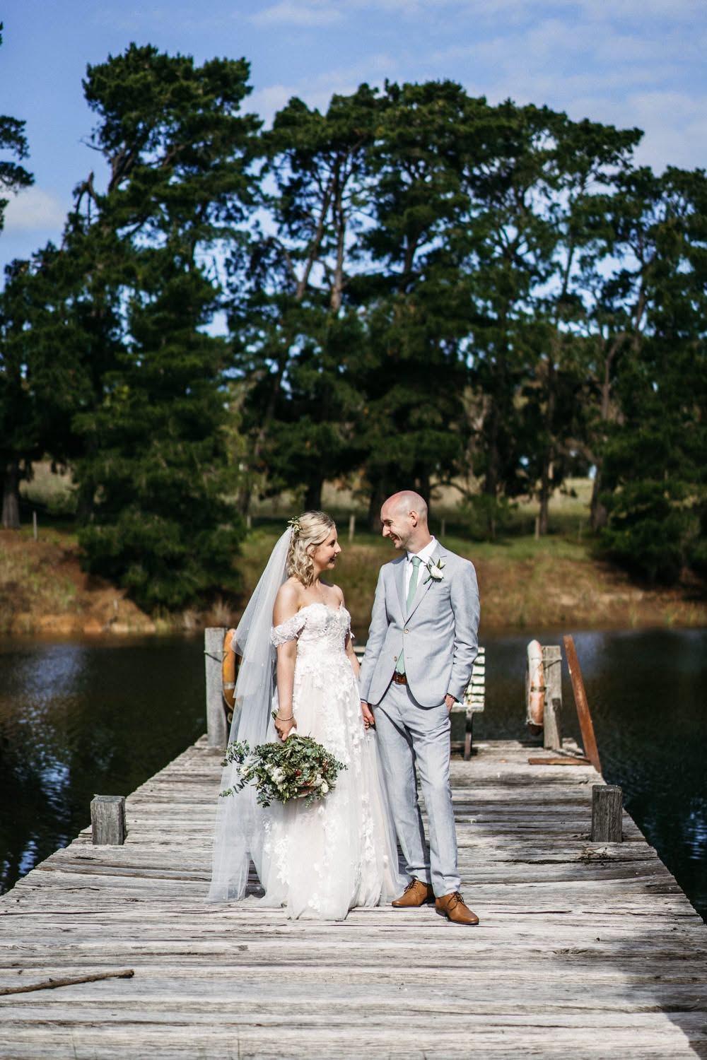Bride and groom on the dam pier